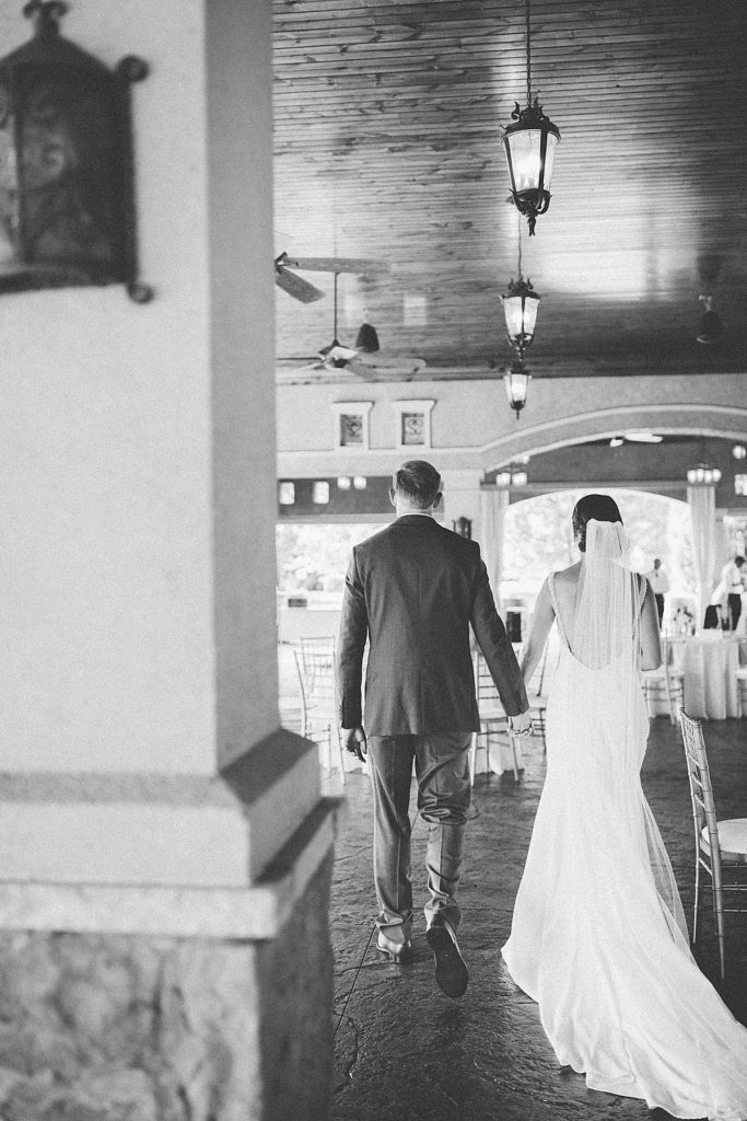 bride and groom walking through Gervasi reception