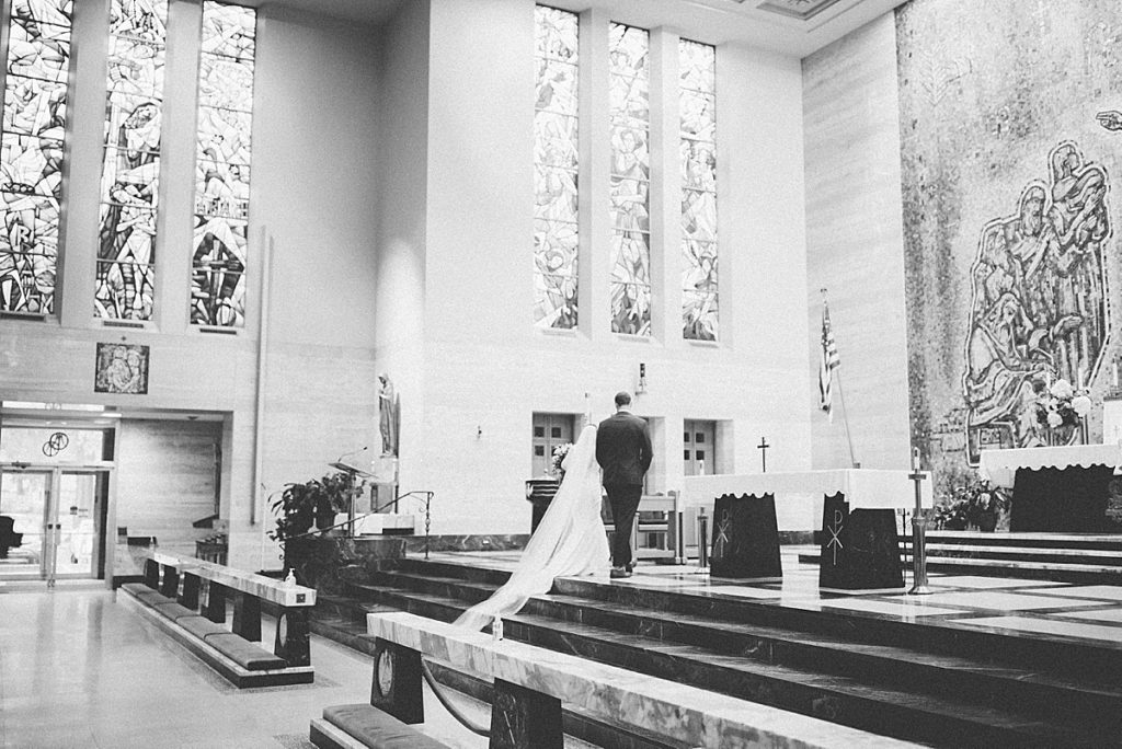 bride and groom on altar