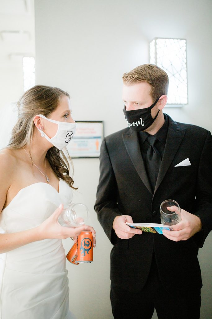 bride and groom wearing masks on their wedding day