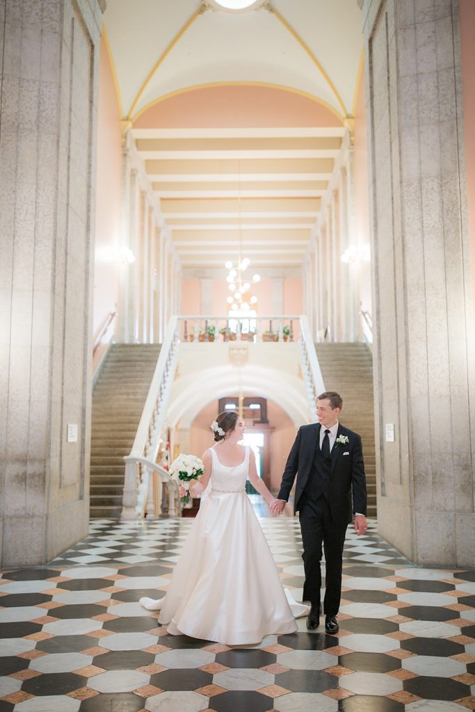 bride and groom inside the center of the Statehouse