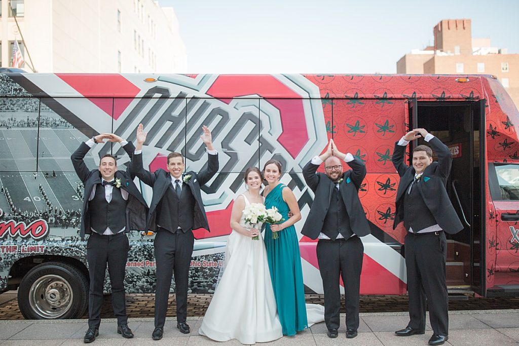 OHIO hands in front of the party bus