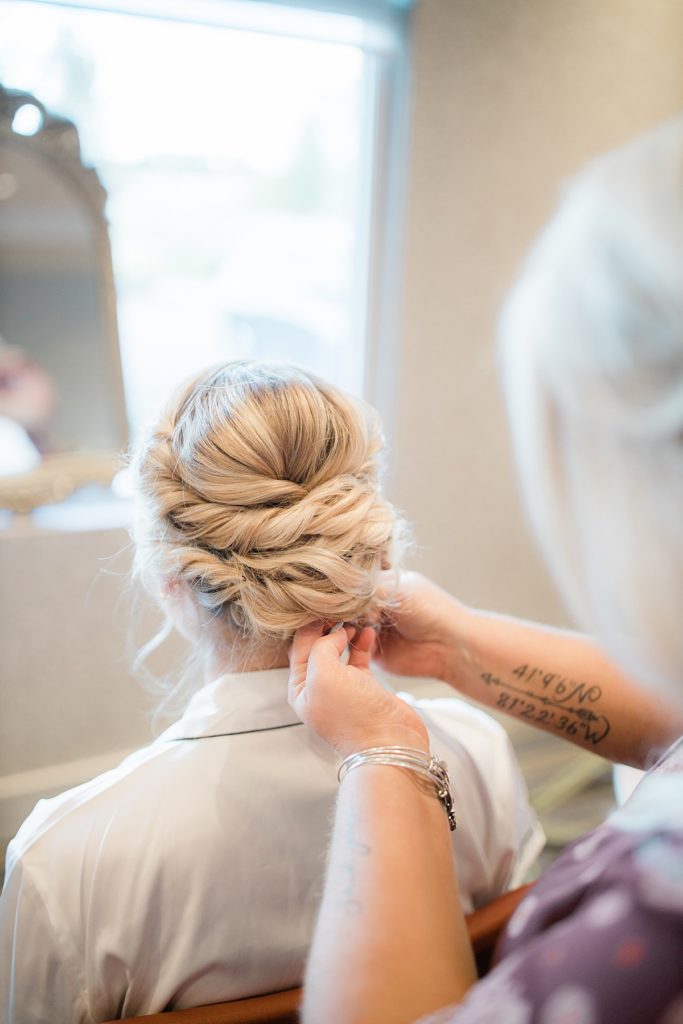 bride getting her hair finished