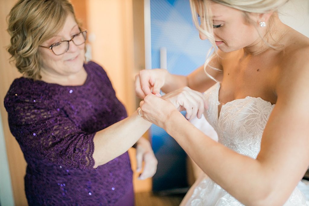 bride helping mom put her bracelet on