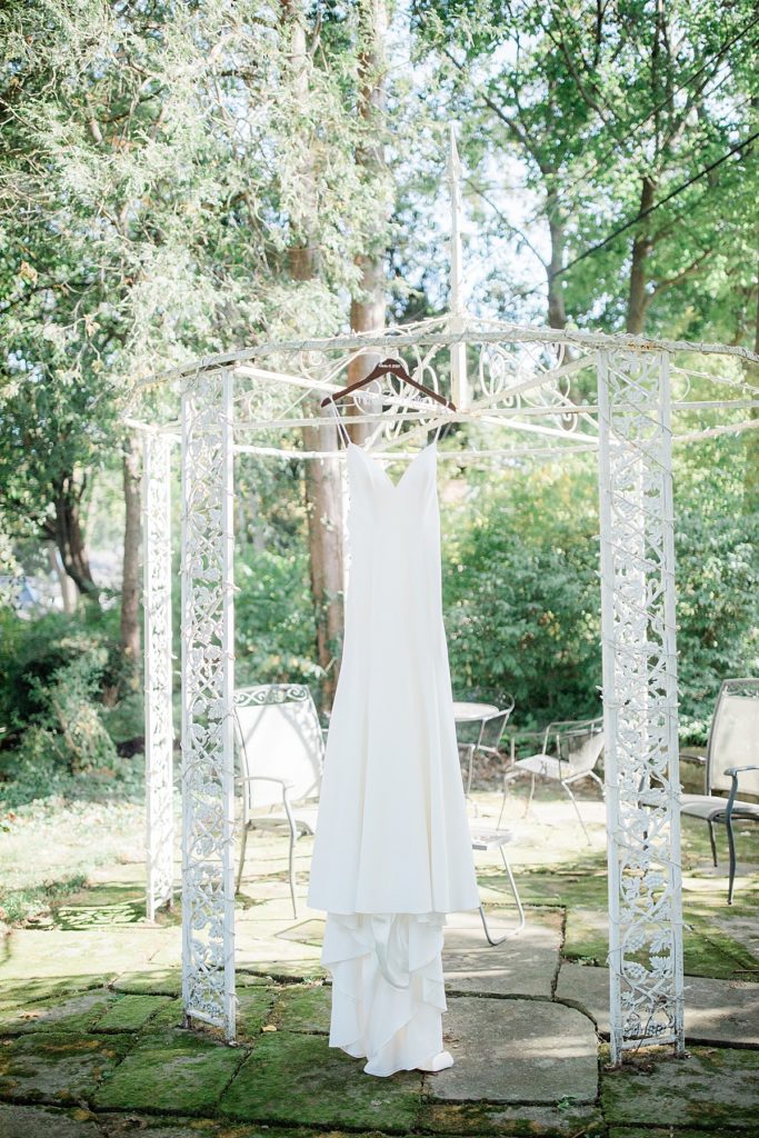 the bride's dress hanging outside