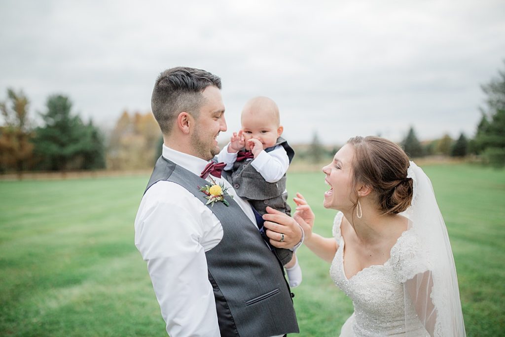 bride and groom portraits with their son