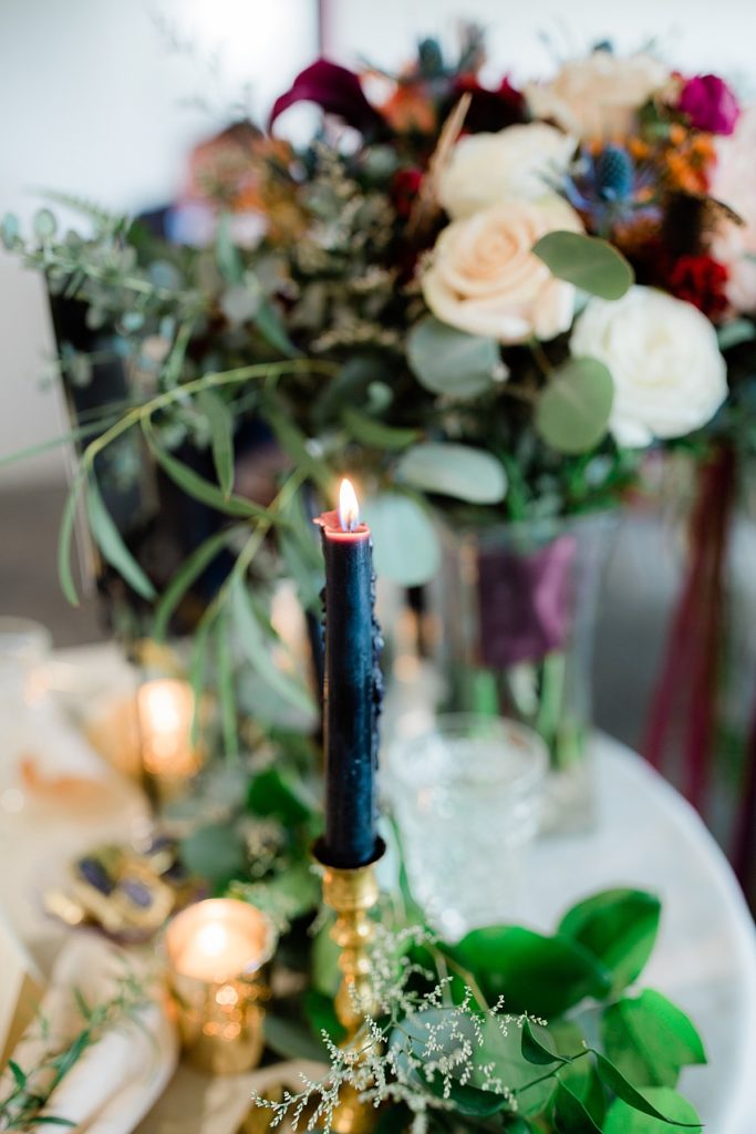 table decor detail shot with candles burning