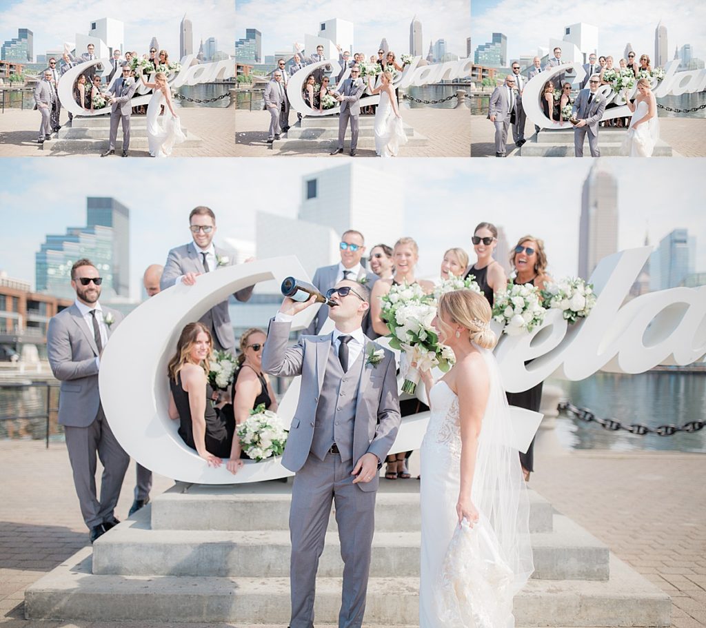 bridal party in Cleveland at the CLE sign