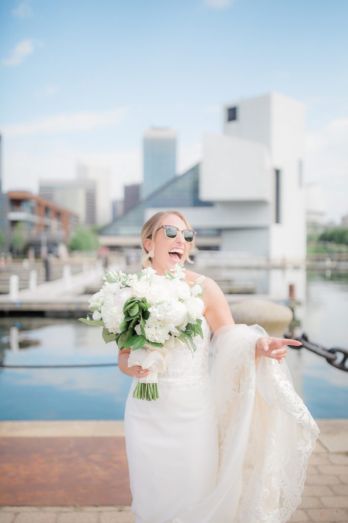bride laughing with sunglasses on