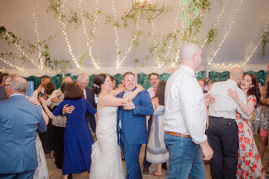 bride and groom enjoy the reception dancing