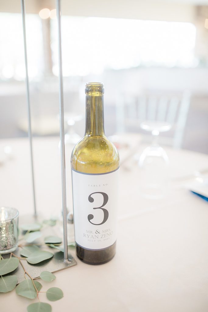 wedding reception decor: wine bottle center pieces