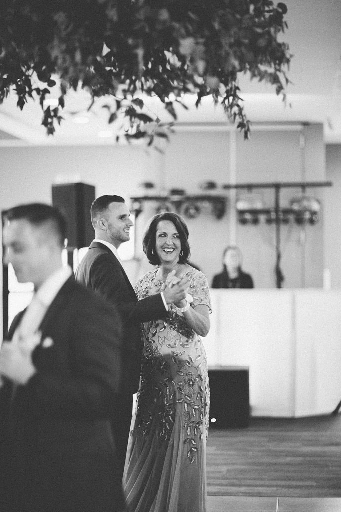 groom and mom dancing during reception