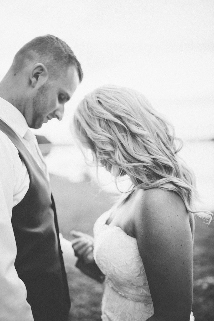 creative black and white photo of bride and groom in the moment