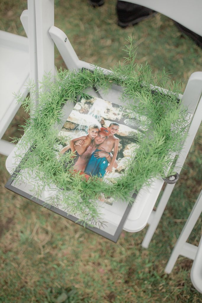 framed image of the grooms father on the chair to memorialize him during the ceremony