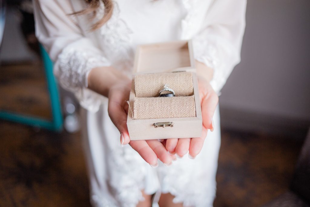 wedding bridal details, bride hands, ring box