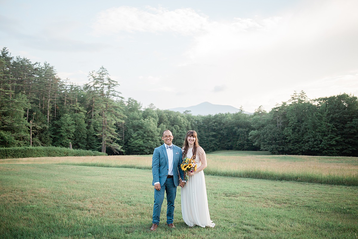 bride and groom portraits with mountain background