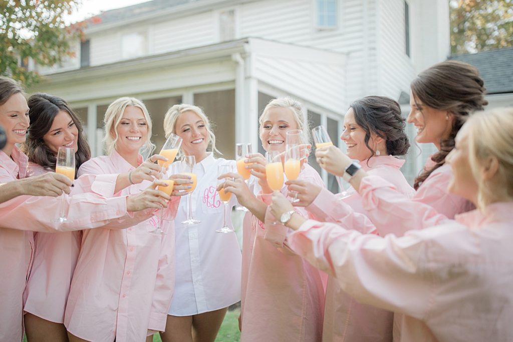 bridesmaids toasting in shirts